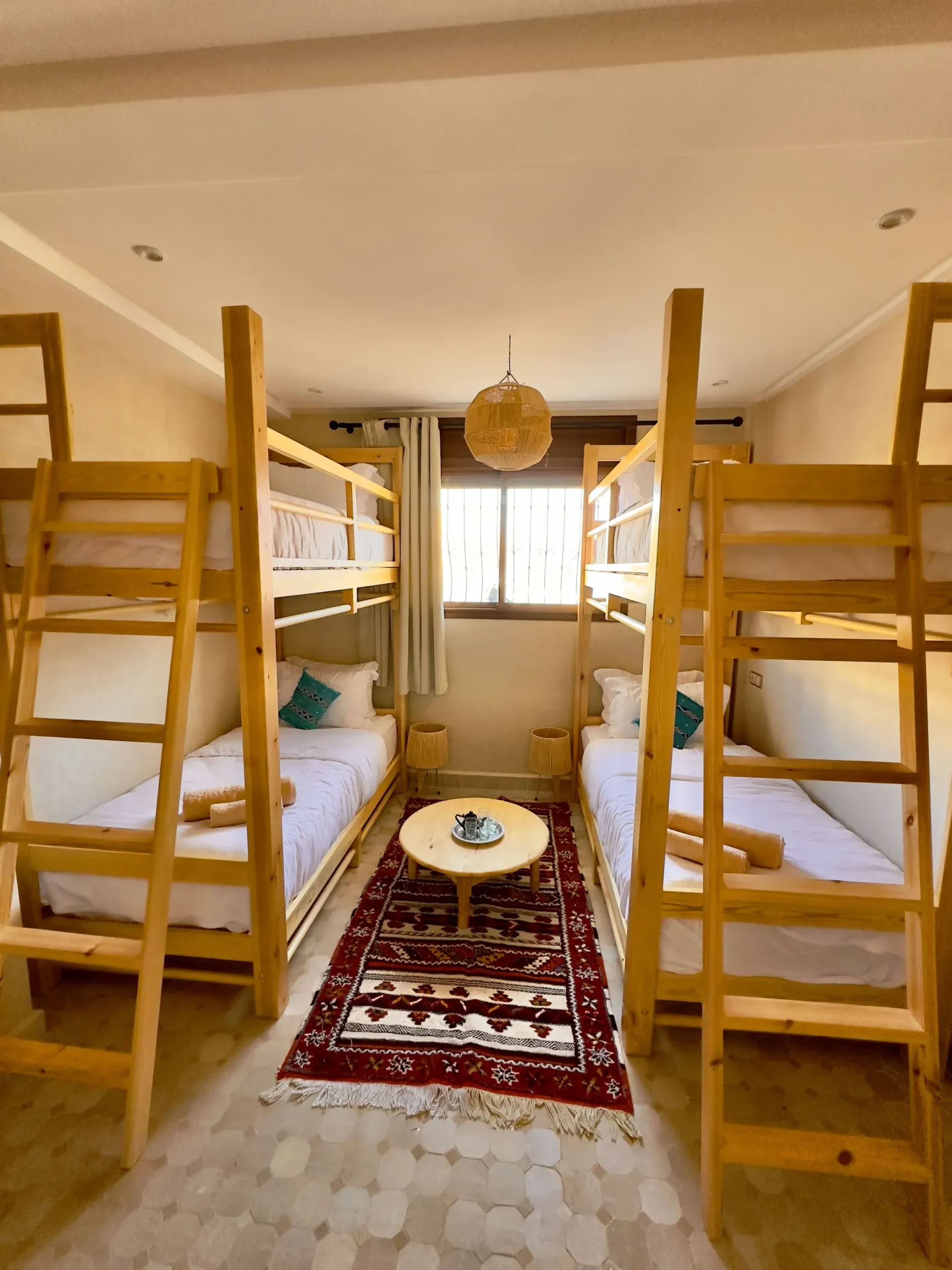 Cozy shared room with bunk beds and Moroccan decor.